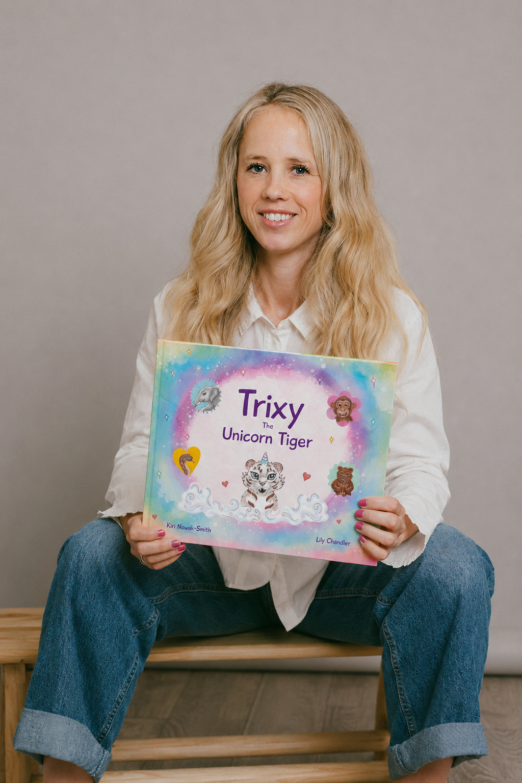 Kiri Nowak-Smith holding Trixy the Unicorn Tiger